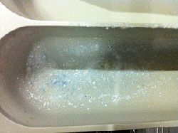 Trop de lessive ou pression de l'eau trop basse